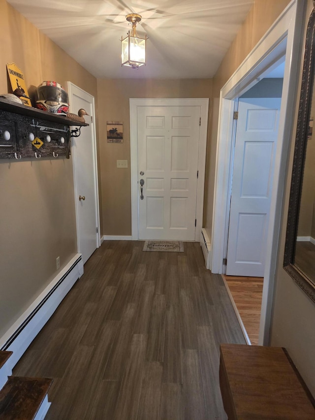 125 Connecticut Ave, Millinocket, ME 04462 - entryway featuring baseboard heating and dark wood-type flooring