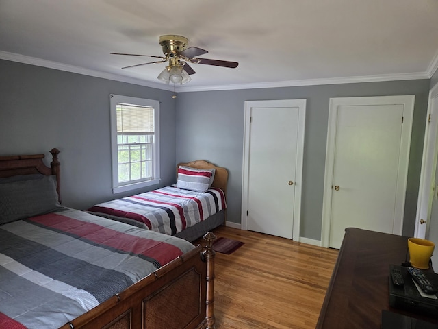 125 Connecticut Ave, Millinocket, ME 04462 - bedroom with wood finished floors, crown molding, and ceiling fan