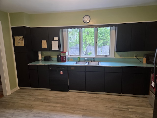 125 Connecticut Ave, Millinocket, ME 04462 - kitchen with dishwasher, dark cabinets, light countertops, and light wood-style flooring