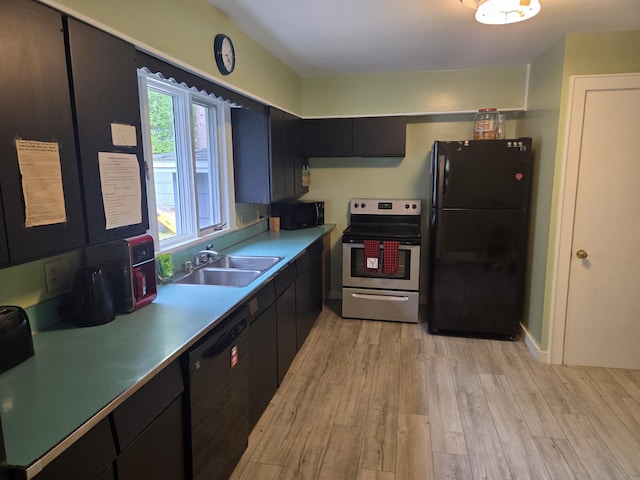 125 Connecticut Ave, Millinocket, ME 04462 - kitchen featuring black appliances, light wood-style floors, light countertops, and dark cabinets