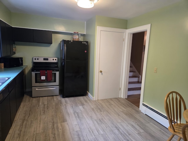 125 Connecticut Ave, Millinocket, ME 04462 - kitchen featuring black appliances, dark cabinets, light wood-style flooring, light countertops, and a baseboard radiator