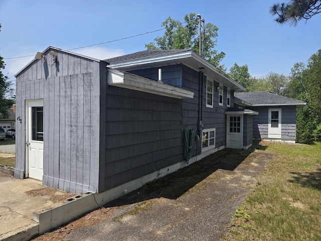 125 Connecticut Ave, Millinocket, ME 04462 - view of property exterior featuring a shingled roof