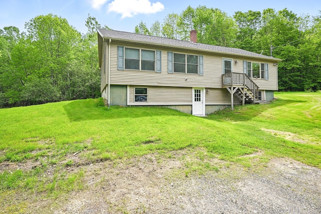 23 Mccutcheon Way, Sidney, ME 04330 - back of house with a chimney and a yard