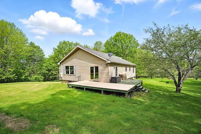 23 Mccutcheon Way, Sidney, ME 04330 - rear view of property with a lawn and a deck