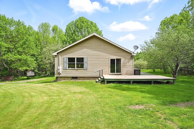 23 Mccutcheon Way, Sidney, ME 04330 - rear view of property featuring a yard and a wooden deck