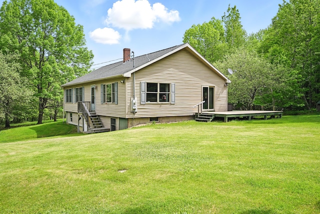 23 Mccutcheon Way, Sidney, ME 04330 - back of house featuring a deck, a chimney, and a yard