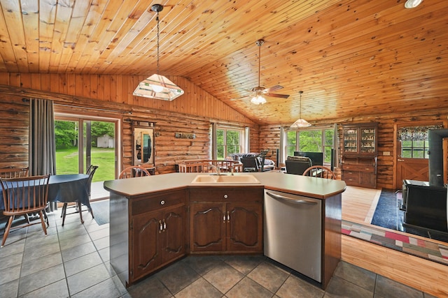 23 Mccutcheon Way, Sidney, ME 04330 - kitchen featuring stainless steel dishwasher, rustic walls, wood ceiling, open floor plan, and light countertops