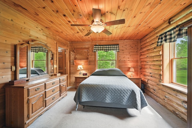 23 Mccutcheon Way, Sidney, ME 04330 - bedroom with light colored carpet, wood ceiling, rustic walls, and wood walls