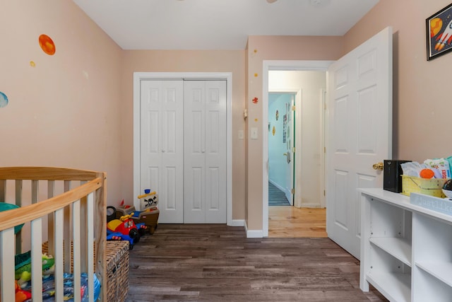 504 Balch Mill Rd, Newfield, ME 04095 - bedroom featuring dark wood finished floors, a closet, and a nursery area