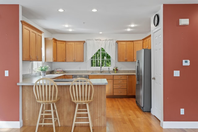 17 Tuttle Ln, Wells, ME 04090 - kitchen featuring stainless steel appliances, a peninsula, light countertops, light wood-type flooring, and recessed lighting