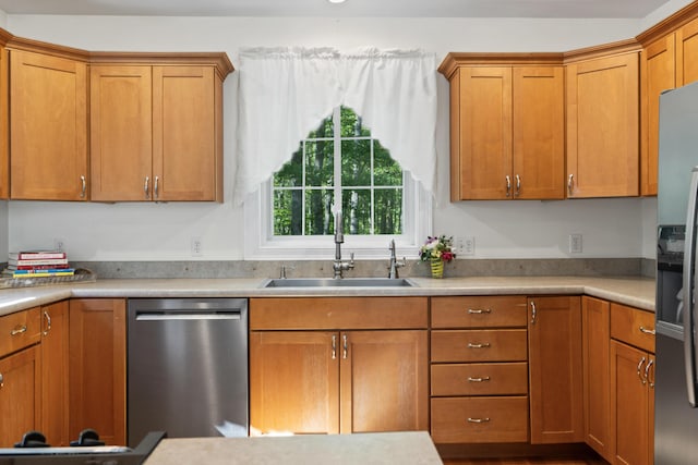 17 Tuttle Ln, Wells, ME 04090 - kitchen featuring stainless steel dishwasher, brown cabinets, and light countertops