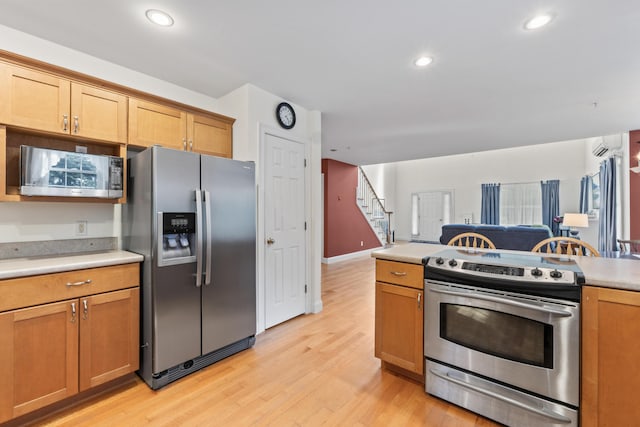 17 Tuttle Ln, Wells, ME 04090 - kitchen with appliances with stainless steel finishes, light countertops, light wood-style floors, open floor plan, and recessed lighting