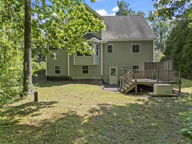 17 Tuttle Ln, Wells, ME 04090 - back of property featuring stairway, a wooden deck, a lawn, and roof with shingles