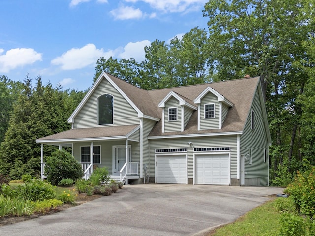 17 Tuttle Ln, Wells, ME 04090 - view of front of home featuring asphalt driveway, a porch, and roof with shingles