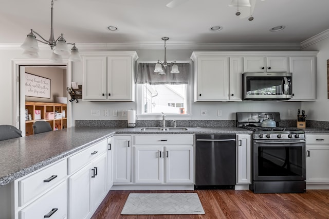 123 Lasalle Dr, Bangor, ME 04401 - kitchen featuring stainless steel appliances, white cabinets, crown molding, a chandelier, and dark wood finished floors