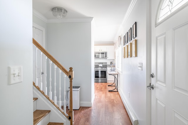 123 Lasalle Dr, Bangor, ME 04401 - entryway with light wood-type flooring, stairs, and crown molding