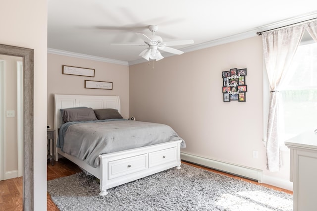 123 Lasalle Dr, Bangor, ME 04401 - bedroom with a baseboard heating unit, ornamental molding, wood finished floors, and a ceiling fan