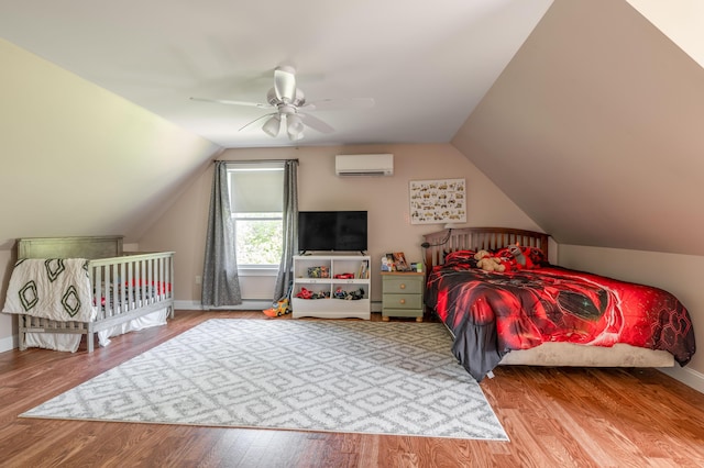 123 Lasalle Dr, Bangor, ME 04401 - bedroom featuring a wall mounted air conditioner, lofted ceiling, wood finished floors, a baseboard heating unit, and a ceiling fan