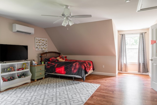 123 Lasalle Dr, Bangor, ME 04401 - bedroom with a wall unit AC, wood finished floors, vaulted ceiling, and a ceiling fan