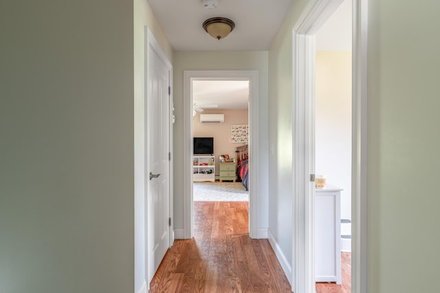 123 Lasalle Dr, Bangor, ME 04401 - hallway featuring a wall mounted air conditioner and wood finished floors