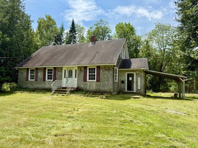1606 Avenue Rd, Exeter, ME 04435 - view of front of home with a front yard, a shingled roof, a carport, and a chimney