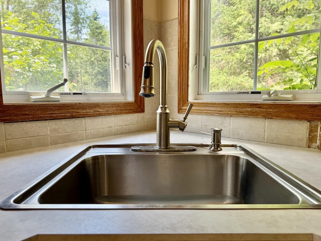 1606 Avenue Rd, Exeter, ME 04435 - kitchen view of tasteful backsplash and light countertops