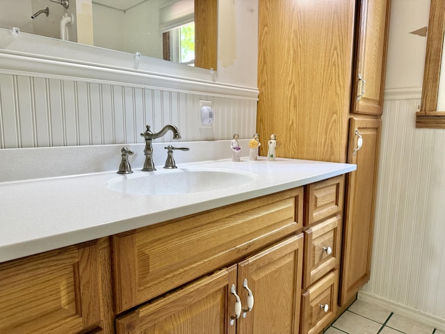 1606 Avenue Rd, Exeter, ME 04435 - bathroom featuring vanity, tile patterned floors, and wainscoting