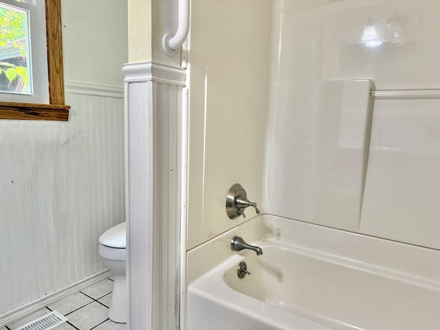 1606 Avenue Rd, Exeter, ME 04435 - bathroom with tile patterned floors, bathtub / shower combination, and a wainscoted wall