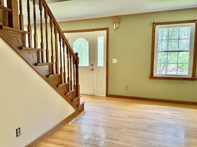 1606 Avenue Rd, Exeter, ME 04435 - entrance foyer featuring light wood-type flooring and stairway