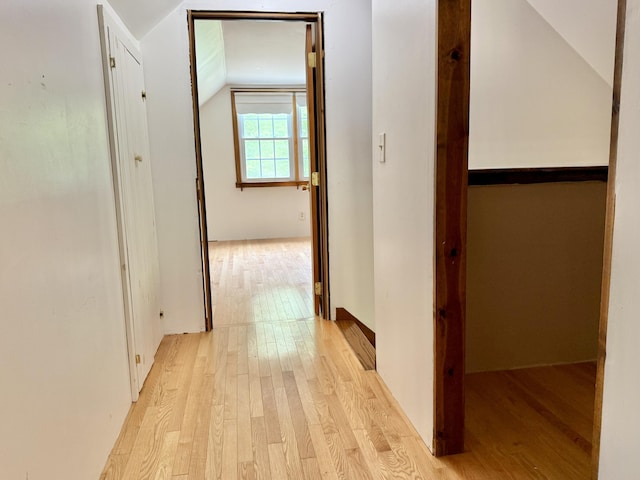 1606 Avenue Rd, Exeter, ME 04435 - corridor with vaulted ceiling and light wood finished floors