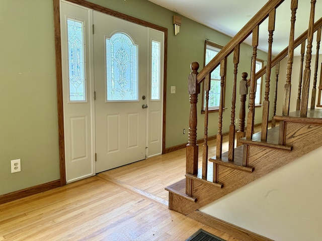 1606 Avenue Rd, Exeter, ME 04435 - entryway with light wood finished floors and stairway