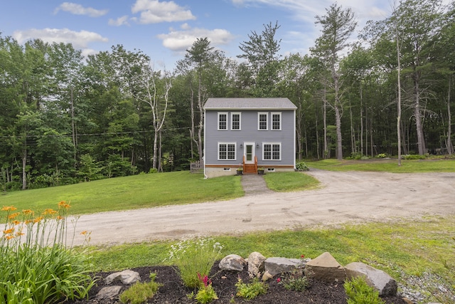 1031 Hallowell Rd, Durham, ME 04222 - view of front of home with dirt driveway, a front lawn, and a view of trees