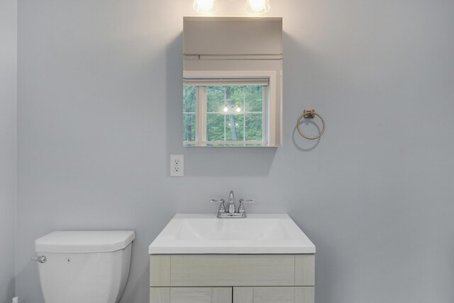 1031 Hallowell Rd, Durham, ME 04222 - half bathroom featuring vanity and toilet