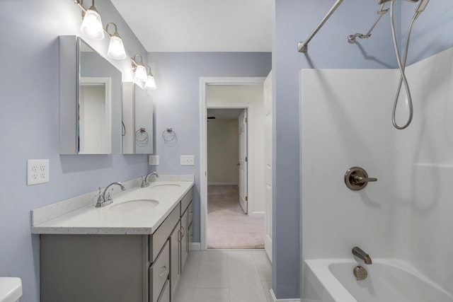 1031 Hallowell Rd, Durham, ME 04222 - full bathroom with washtub / shower combination, double vanity, and tile patterned floors