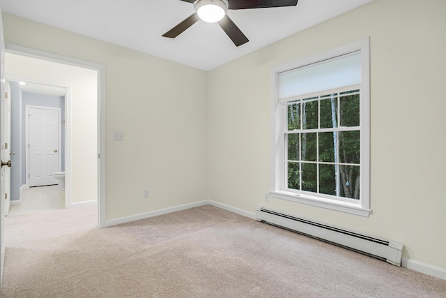 1031 Hallowell Rd, Durham, ME 04222 - spare room with baseboard heating, carpet floors, ceiling fan, and plenty of natural light