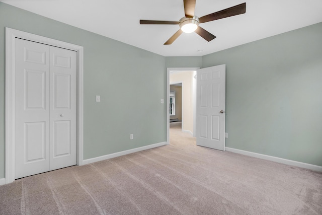 1031 Hallowell Rd, Durham, ME 04222 - unfurnished bedroom featuring carpet floors, a baseboard radiator, ceiling fan, and a closet