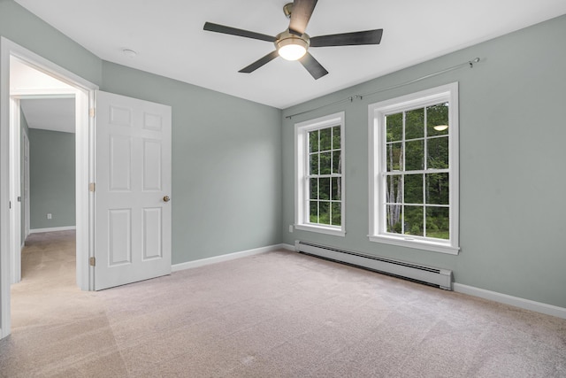 1031 Hallowell Rd, Durham, ME 04222 - unfurnished room featuring a baseboard radiator, carpet, a ceiling fan, and a smoke detector