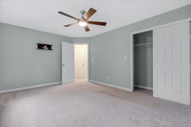 1031 Hallowell Rd, Durham, ME 04222 - unfurnished bedroom featuring light colored carpet, a closet, and ceiling fan