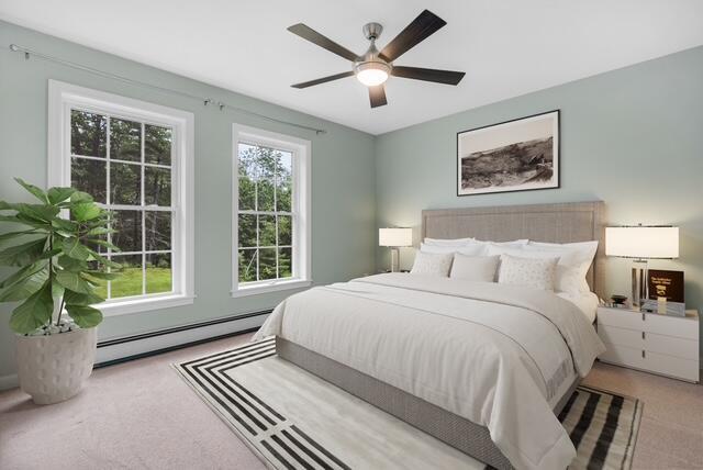 1031 Hallowell Rd, Durham, ME 04222 - carpeted bedroom with baseboard heating and a ceiling fan