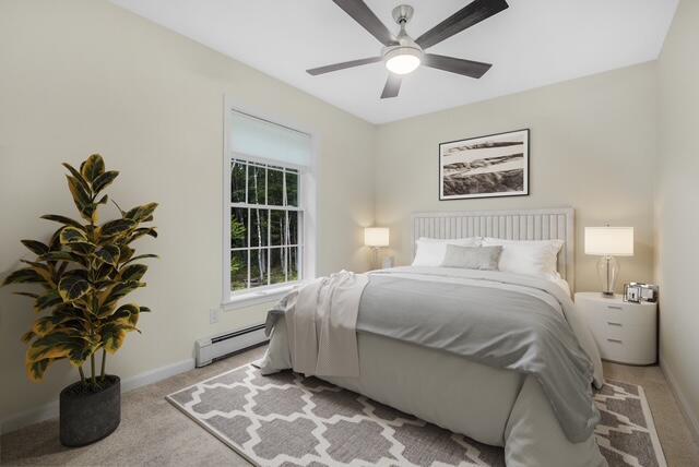 1031 Hallowell Rd, Durham, ME 04222 - bedroom with light carpet, baseboard heating, and ceiling fan