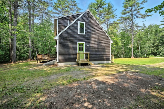 117 Badger Cir, Limerick, ME 04048 - back of house featuring a yard, a deck, and a forest view