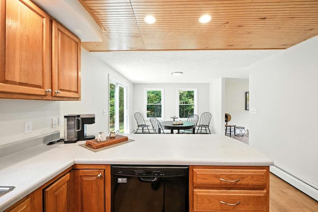 117 Badger Cir, Limerick, ME 04048 - kitchen featuring dishwasher, baseboard heating, a peninsula, wooden ceiling, and light countertops