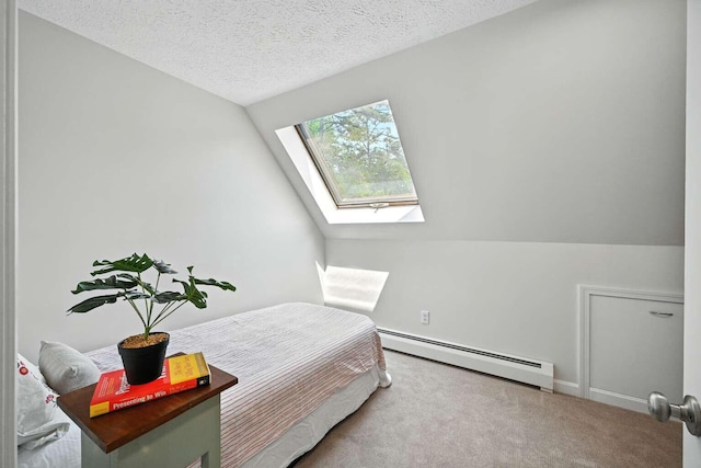 117 Badger Cir, Limerick, ME 04048 - bedroom with a baseboard radiator, a skylight, carpet floors, vaulted ceiling, and a textured ceiling
