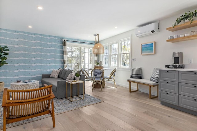 20 Shore Rd Unit 2A, Ogunquit, ME 03907 - living area with a wall mounted air conditioner, light wood-style flooring, and recessed lighting