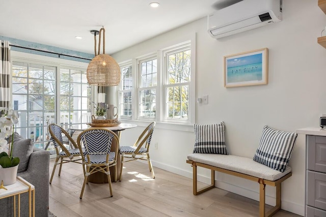 20 Shore Rd Unit 2A, Ogunquit, ME 03907 - dining area featuring a wall unit AC, plenty of natural light, light wood-style floors, and recessed lighting