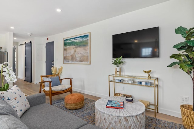 20 Shore Rd Unit 2A, Ogunquit, ME 03907 - living area with a barn door, wood finished floors, and recessed lighting