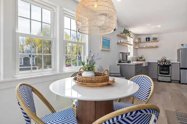 20 Shore Rd Unit 2A, Ogunquit, ME 03907 - dining space featuring plenty of natural light and light wood-style floors