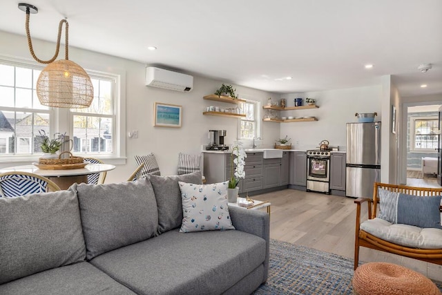 20 Shore Rd Unit 2A, Ogunquit, ME 03907 - living area featuring a wall mounted AC, light wood-style floors, and recessed lighting