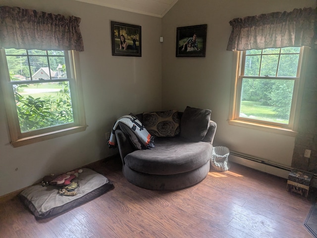 9 Deer Hill Ln, Hampden, ME 04444 - living area featuring a baseboard heating unit, lofted ceiling, and wood finished floors
