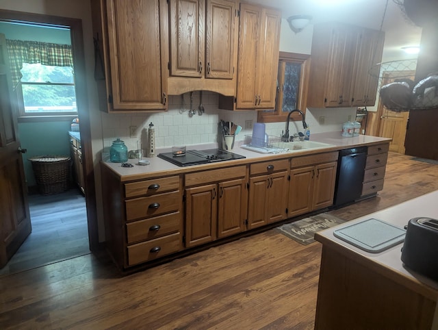 9 Deer Hill Ln, Hampden, ME 04444 - kitchen featuring black appliances, dark wood-type flooring, light countertops, and tasteful backsplash